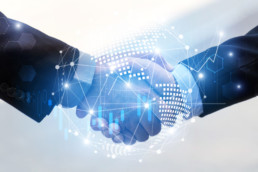 business man handshake with effect global world map network link connection and graph chart of stock market graphic diagram, digital technology, internet communication, teamwork, partnership concept
